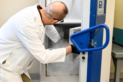 Chemist pulling sample from -80 degrees celcius freezer
